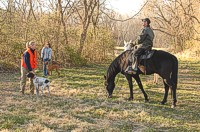 A warm Spinone and smiling handler head out of the Master bird field.