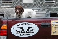 Shelby earns a big frequent-customer discount by posing for a shameless truck-logo plug for his pro handler.