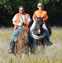 The senior/master test judges leave the bird field and head to the line to meet the next pair of handlers.