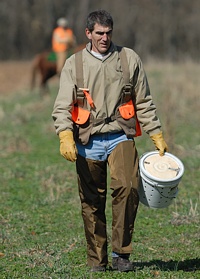 Walking back from the bird field after dispensing quail from the bird bucket.