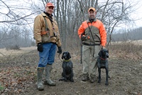 A cold grey morning, but these two handlers are looking forward to their runs.