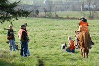 A quick word between handlers, the marshal, a judge, and the AKC rep visiting the event.