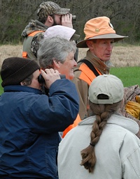 Spectators watching the tracking event need to stay out of the way. Binoculars are a popular accessory.